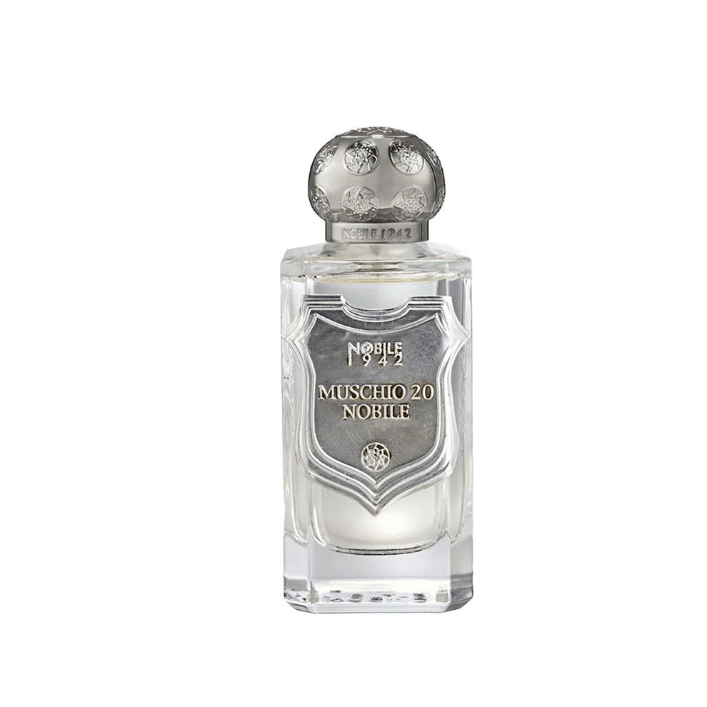 Perfume bottle with silver cap and label on a white background