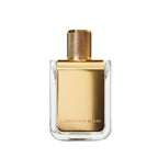 Square glass perfume bottle with gold metal label printed with 'Veronique Gabai' and a gold cap on a white background.