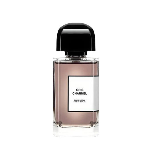Square perfume bottle wiith a black cap and labeled 'Gris Charnel' on a white background