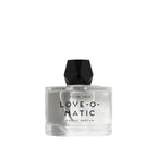 Perfume bottle with faceted black cap labeled 'LOVE-O-MATIC' on a white background