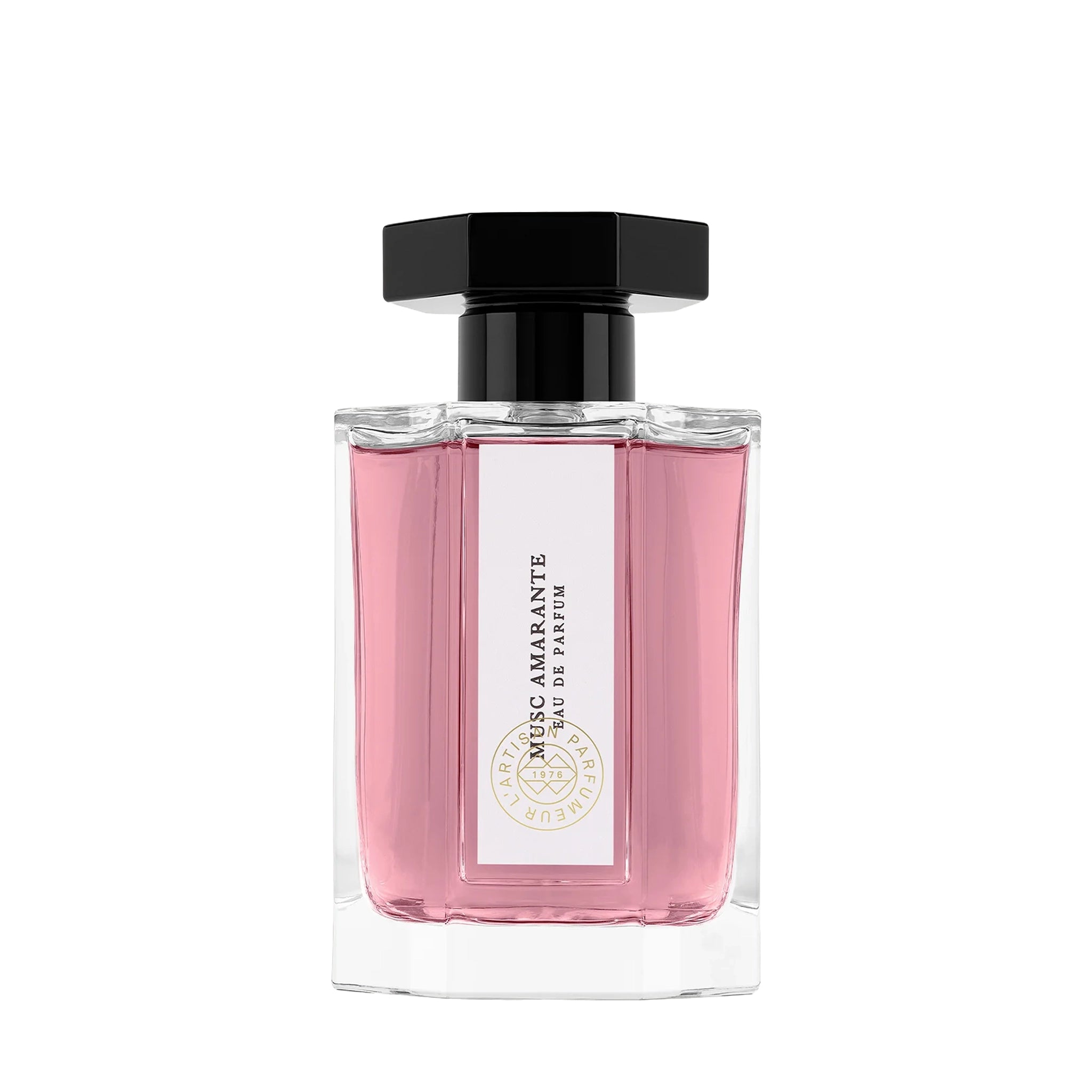 Pink perfume bottle with a white label, pink liquid and black cap on a white background