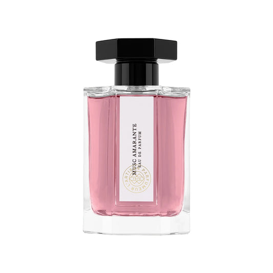 Pink perfume bottle with a white label, pink liquid and black cap on a white background