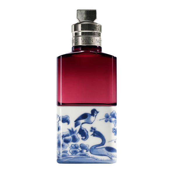 Bottle of Soie Malaquais with decorative blue and white design on a white background